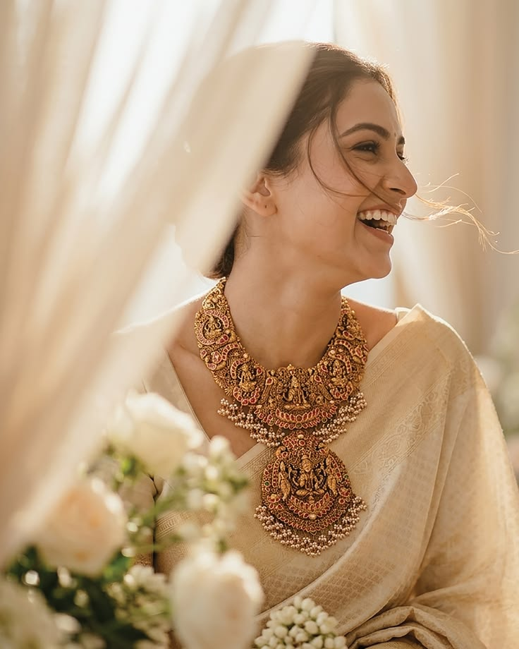 Woman wearing traditional Indian gold necklace and jewellery